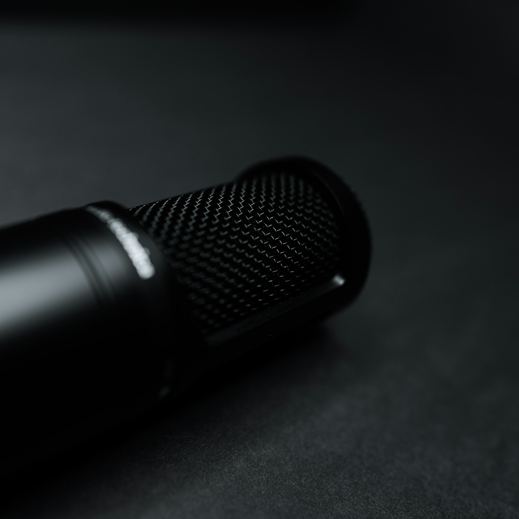 A close-up of a black microphone.
